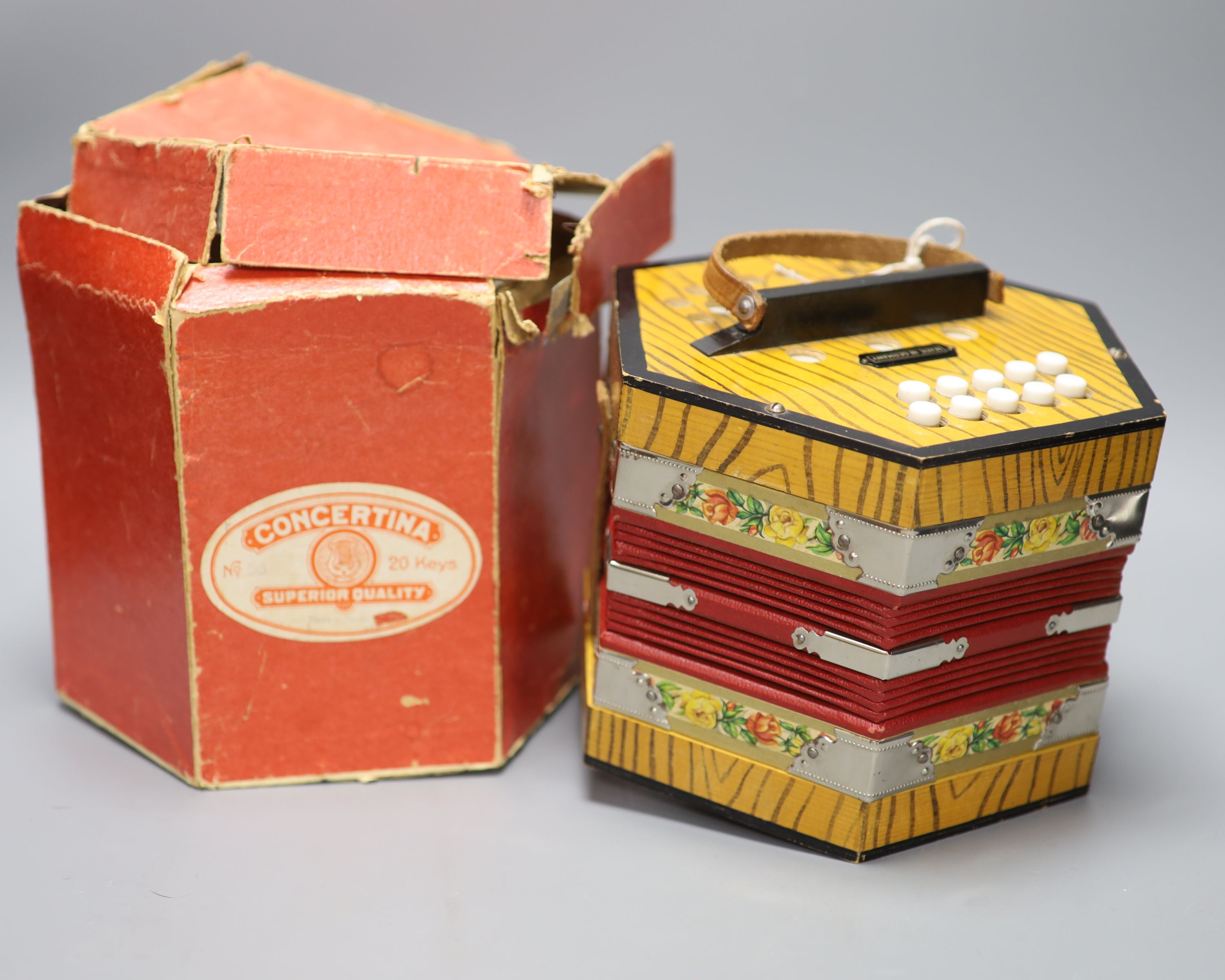 A Bandmaster concertina, rare in original box